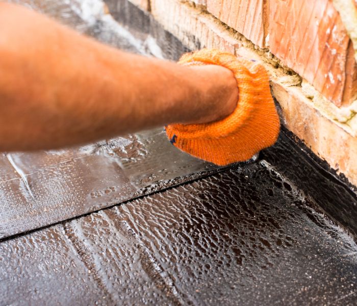 A contractor providing a foundation inspection in the woodlands