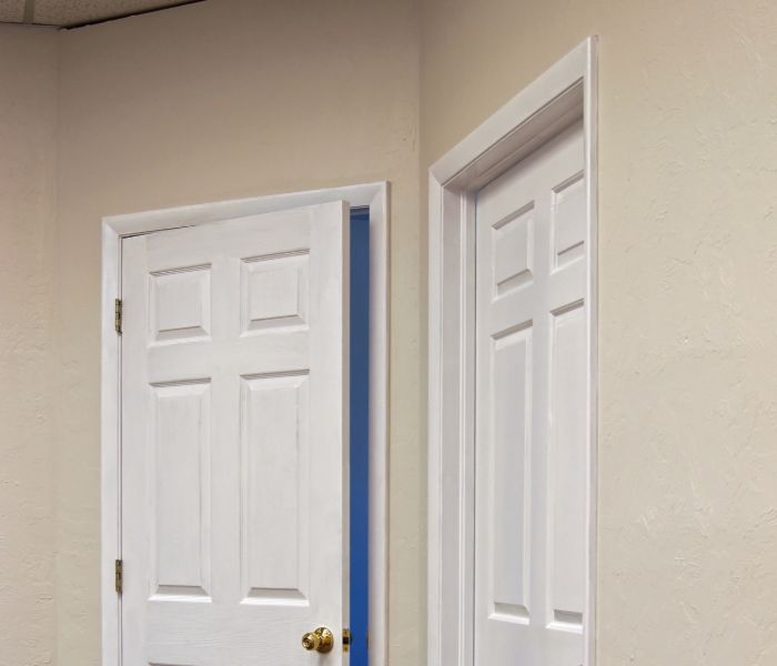 Doors not closing indicating the need for foundation inspection in The Woodlands.